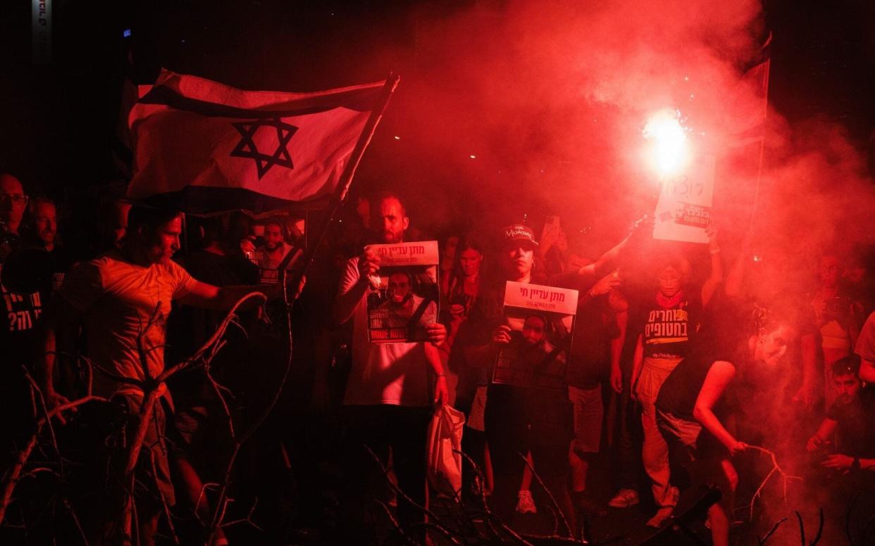 Israelis block a highway while protesting for hostage release