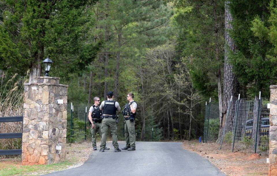 York County Sheriff deputies guard an entrance to the residence of Dr. Robert Lesslie on Thursday, April 8, 2021. Former NFL player Phillip Adams shot 6 people on Wednesday, April 7, 2021 killing Dr. Robert Lesslie, his wife, two grand children and a Gaston HVAC worker. Robert Shook, another Gaston HVAC worker was severely wounded during the shooting in York County. Adams later killed himself at his parents home.