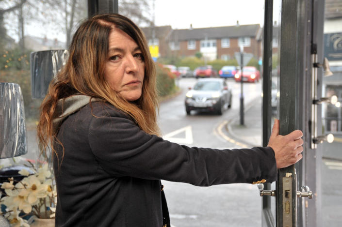 Anita De-Vine's storefront was damaged four times.  (SWNS)