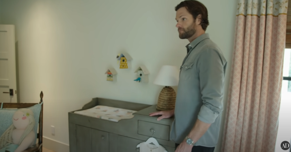 Jared Padalecki in front of his child's changing table