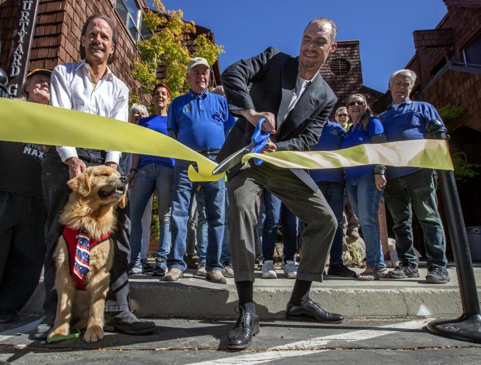 Mayor Max III during a ribbon cutting.