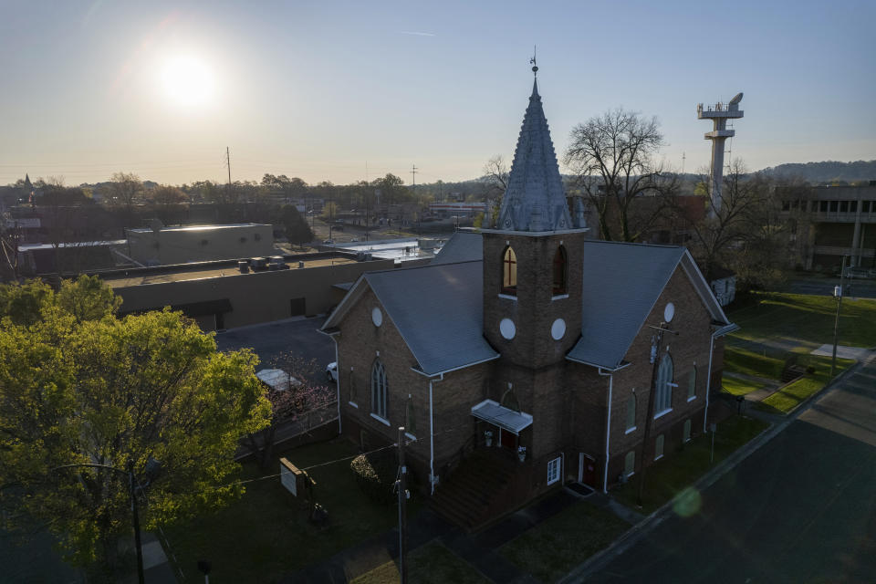 The sun sits behind the Metropolitan United Methodist Church in Rome, Georgia on Sunday, March 31, 2024. This was the local parish Lama Rod Owens attended as a child. Today, he is an influential voice in a new generation of Buddhist teachers. (AP Photo/Jessie Wardarski)