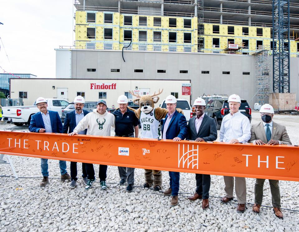 Milwaukee Bucks mascot Bango joins local public officials and executives from companies developing The Trade Hotel MKE, a new Deer District hotel.