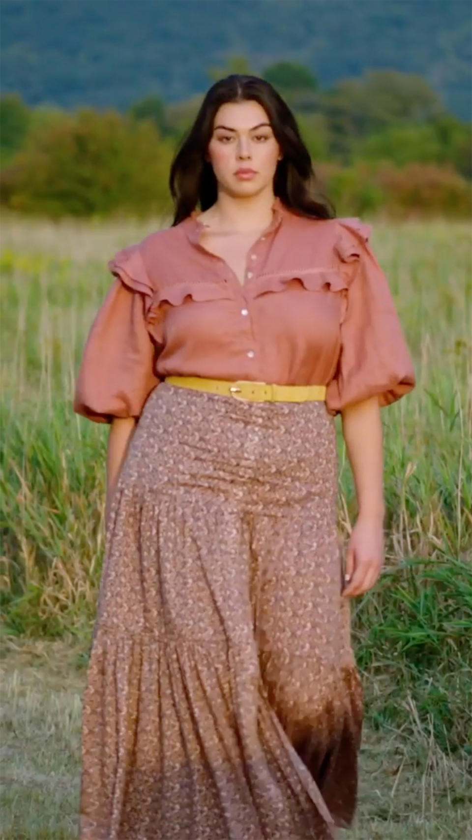 <p>"...speaking of which: the runway was just a freshly cut path in the field. Here's a screengrab of me, mid-catwalk."</p>