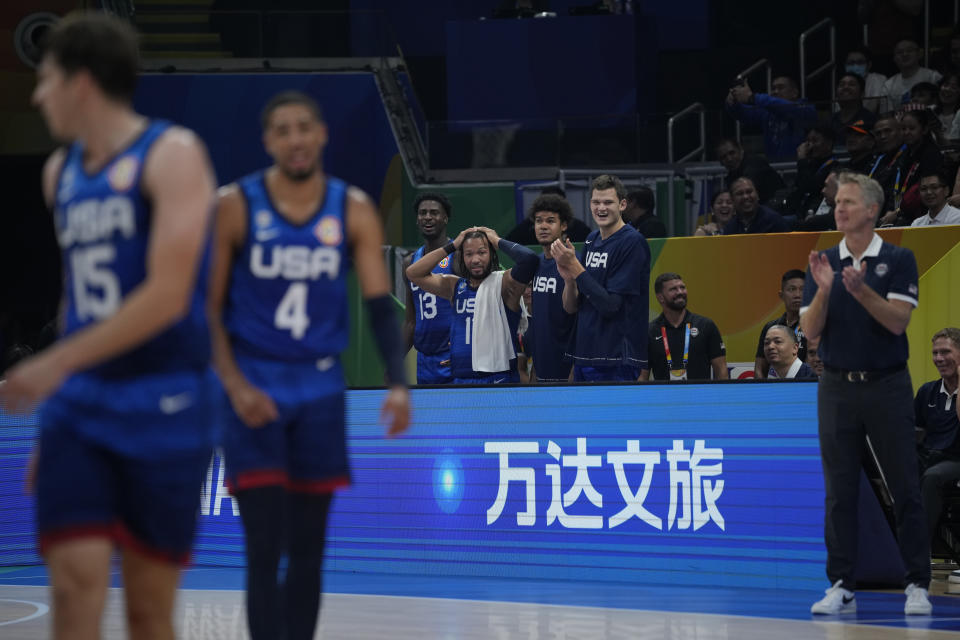 U.S. team members react during the Basketball World Cup quarterfinal game between Italy and U.S. at the Mall of Asia Arena in Manila, Philippines, Tuesday Sept. 5, 2023. (AP Photo/Aaron Favila)