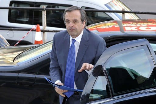 Greek Conservative New Democracy party's leader Antonis Samaras arrives at his headquarters for a televised statement, after his meeting with political leaders of other parties. A first round of government talks in Greece ended in stalemate on Monday after the top-seeded conservative party failed to entice parties opposed to the country's EU-IMF bailout deal to join a coalition