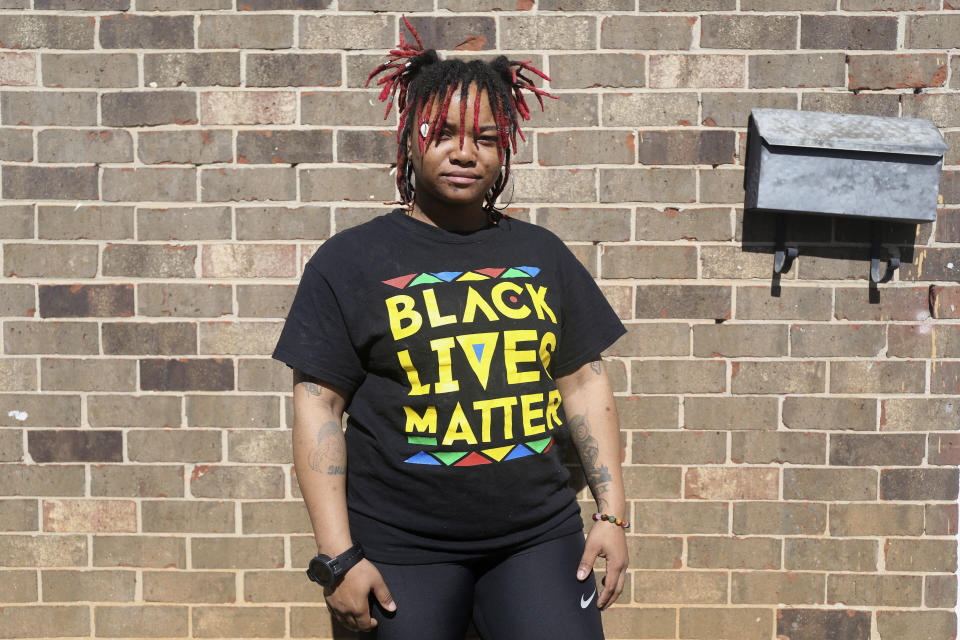 Nia Thomas stands in front of her Atlanta home on Feb. 14, 2024. Thomas was bailed out of jail by the nonprofit Barred Business in May 2022 through the “Mama’s Day Bail Out,” initiative, a practice that could be significantly restricted, if not criminalized, under a recently passed Georgia bill. (AP Photo/R.J. Rico)