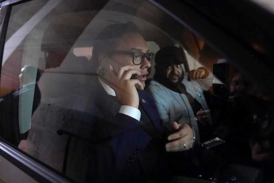 Rep. George Santos, R-N.Y., speaks on a phone as he departs Capitol Hill in Washington, Wednesday, Jan. 11, 2023.