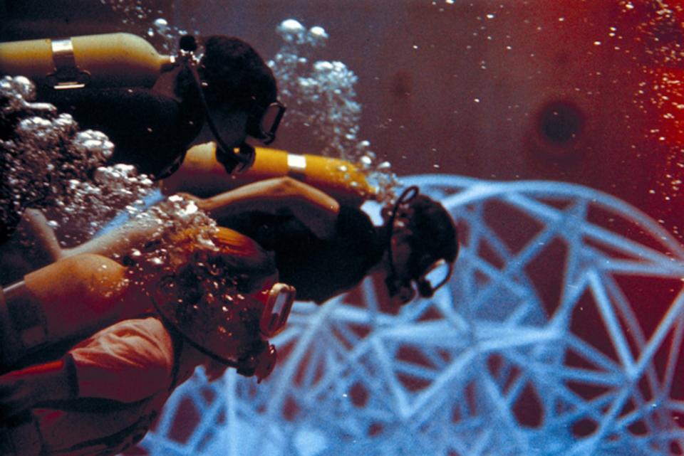 Women scientists train in the Neutral Buoyancy Simulator in 1975. <cite>NASA.</cite>