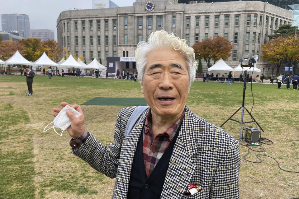 Kim Kap Soo speaks during an interview at a joint memorial altar for victims at Seoul Square in Seoul, South Korea, Tuesday, Nov. 1, 2022. The Halloween party crush in Seoul has caused an outpouring of public sympathy toward the 150 dead, but there's also a strong level of embarrassment and anger from citizens toward the country that they say still ignores safety and regulatory issues. (AP Photo/Hyung-Jin Kim)