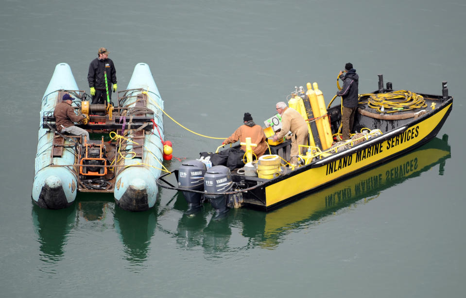 This photo released by Ouray County, shows salvage operations to recover the victims and plane, Thursday March 27, 2014, at the Ridgway Reservoir near Ridgway, Colo., at the site of a downed aircraft, which crashed last Saturday, March 22, 2014, killing five people from Alabama. (AP Photo/Ouray County, William Woody)