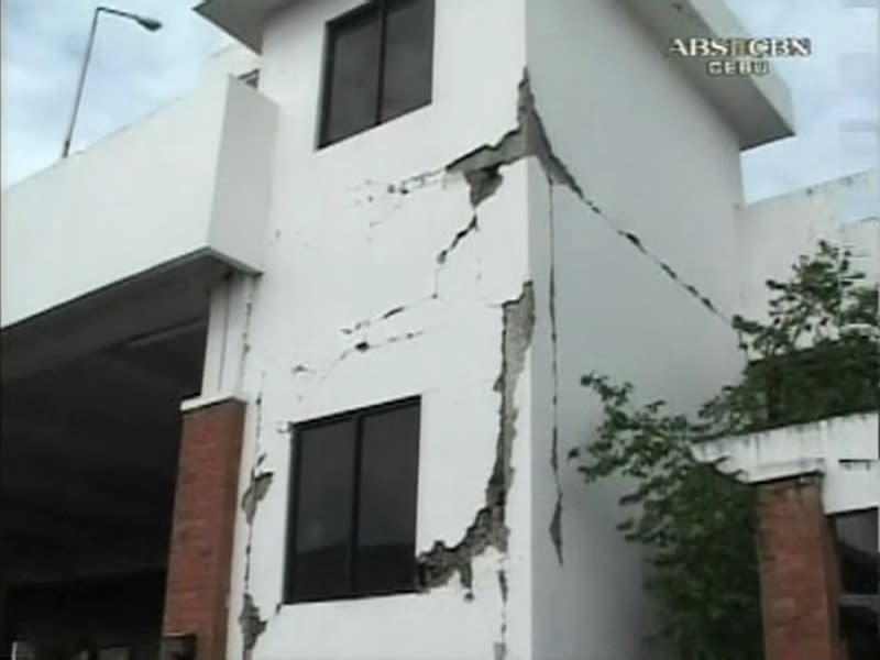 The facade of a damaged building is seen after an earthquake in Cebu City, Philippines, in this October 15, 2013 still image taken from video. At least six people were killed when buildings collapsed on islands popular with tourists in the central Philippines on Tuesday, radio reports said, after an earthquake measuring 7.2 hit the region. REUTERS/ABS-CBN via Reuters TV (PHILIPPINES - Tags: DISASTER ENVIRONMENT) ATTENTION EDITORS - NO SALES. NO ARCHIVES. FOR EDITORIAL USE ONLY. NOT FOR SALE FOR MARKETING OR ADVERTISING CAMPAIGNS. THIS IMAGE HAS BEEN SUPPLIED BY A THIRD PARTY. IT IS DISTRIBUTED, EXACTLY AS RECEIVED BY REUTERS, AS A SERVICE TO CLIENTS. PHILIPPINES OUT. NO COMMERCIAL OR EDITORIAL SALES IN PHILIPPINES