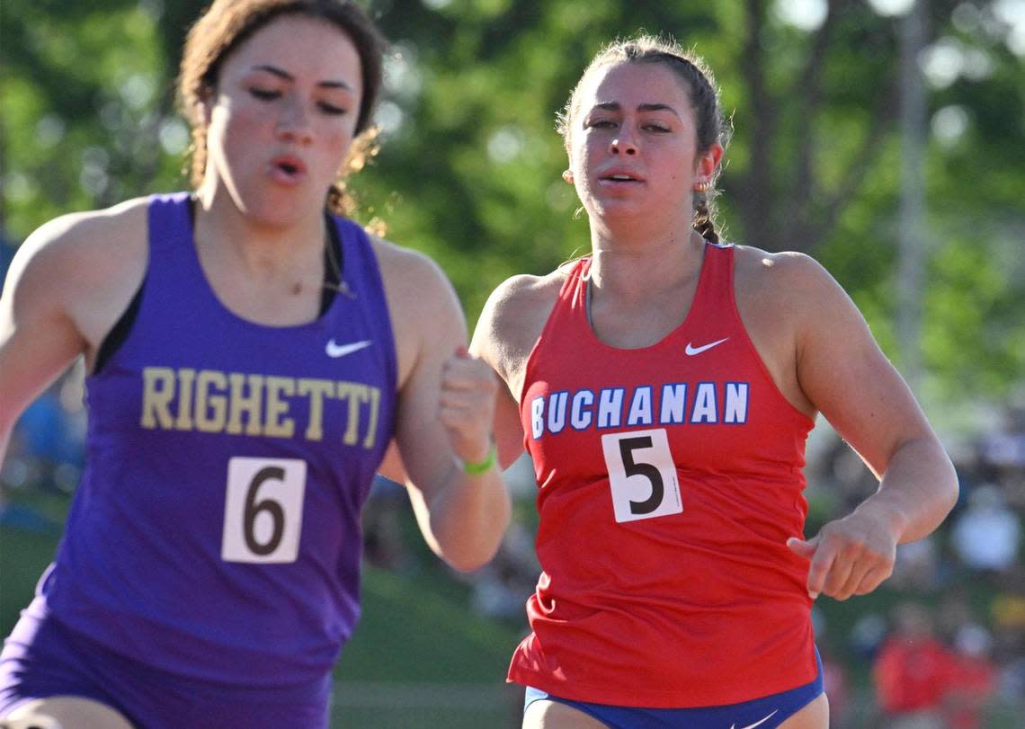 Buchanan’s Jordan Leveque, right, finishes in fourth place behind Righetti’s first place finisher Riley Allen, left, in the 100 at the CIF Central Section Masters track and field meet, held at Veterans Memorial Stadium on Saturday, May 20, 2023 in Clovis. ERIC PAUL ZAMORA/ezamora@fresnobee.com