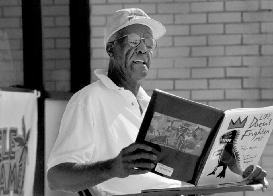 Wally Amos reading a story to children