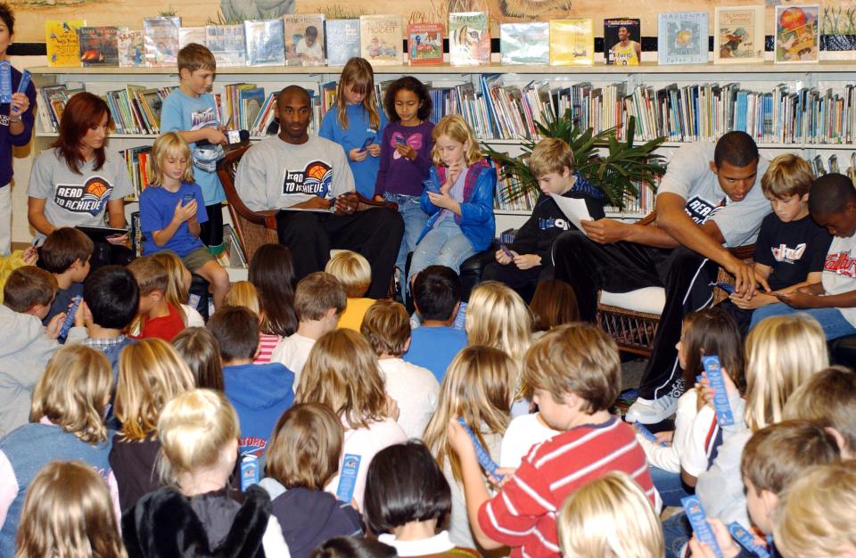 Bryant and former Laker Brian Cook celebrated the NBA's Read to Achieve Week by making a surprise visit to Center Street Elementary School on Oct. 20, 2004, in El Segundo, California, to read to the students.