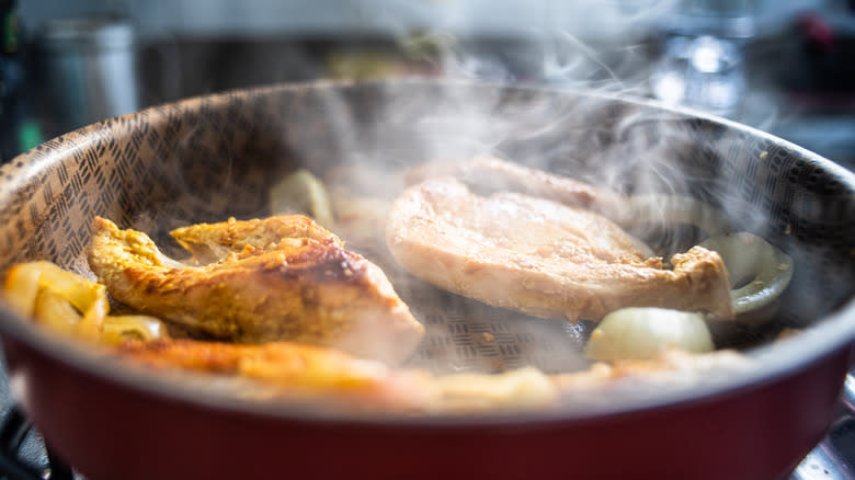 Pan with smoking meat