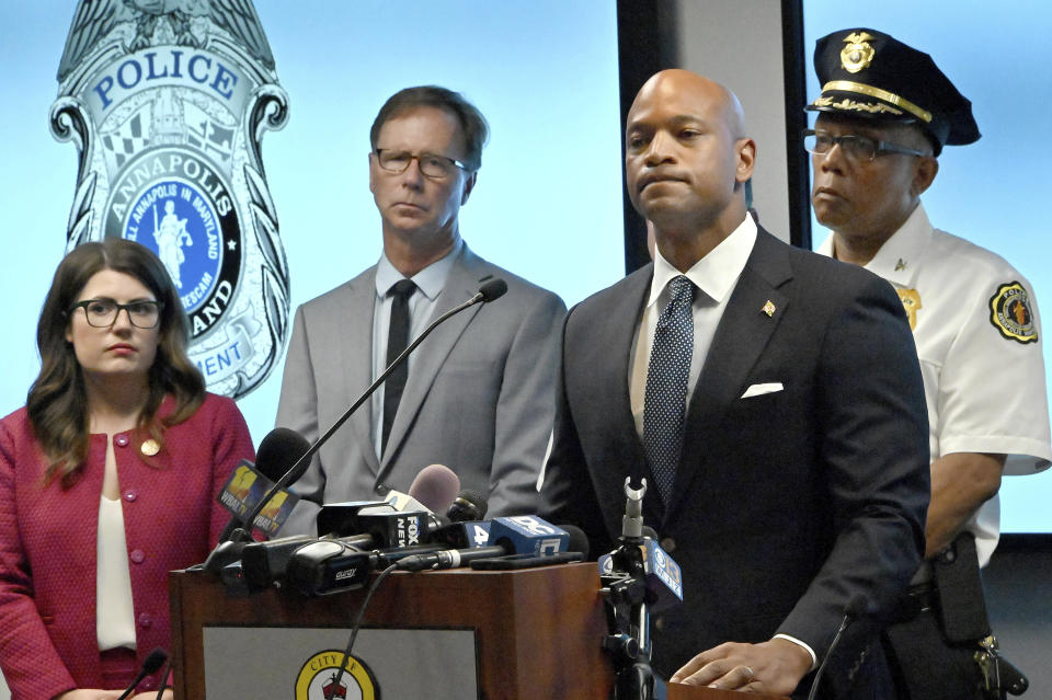 State Senator Sarah Elfreth, left, County Executive Steuart Pittman, and Annapolis Police Chief Edward C. Jackson, listen as Gov. Wes Moore pauses while making a statement at a press conference at Annapolis Police headquarters regarding the shooting overnight in Annapolis, Md., Monday, June 12, 2023. (Jeffrey F. Bill/The Baltimore Sun via AP)