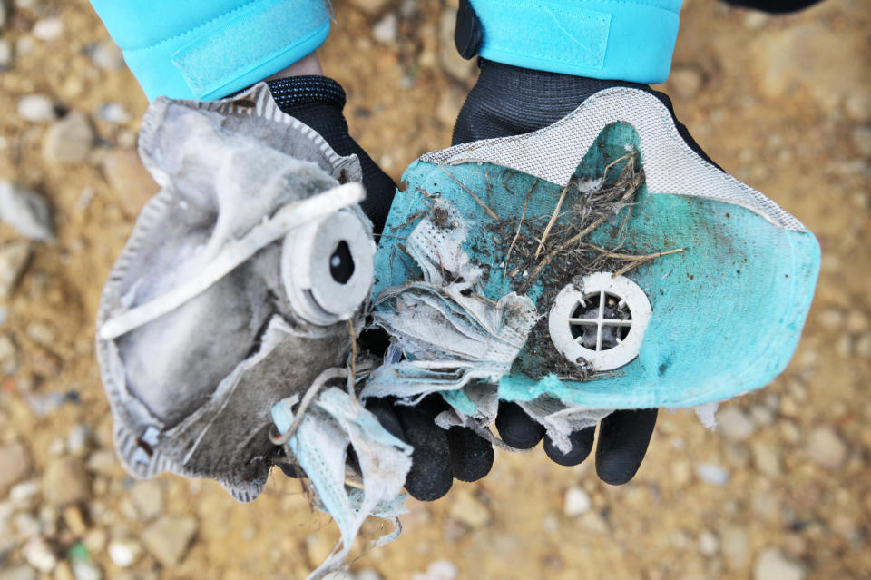 LIVORNO, ITALY - NOVEMBER 07: Face masks found by volunteers during the collection of plastic and microplastic on November 7, 2021 in Livorno, Italy. The cleaning of plastic, microplastics and waste called 'Uniti per il Mare' was organized by the 