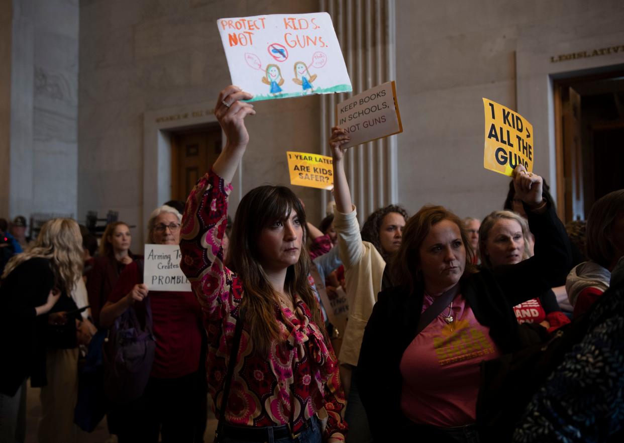 Protesters gather outside the Senate doors after being removed from the gallery at the Tennessee Capitol in Nashville, Tenn., Tuesday, April 9, 2024.