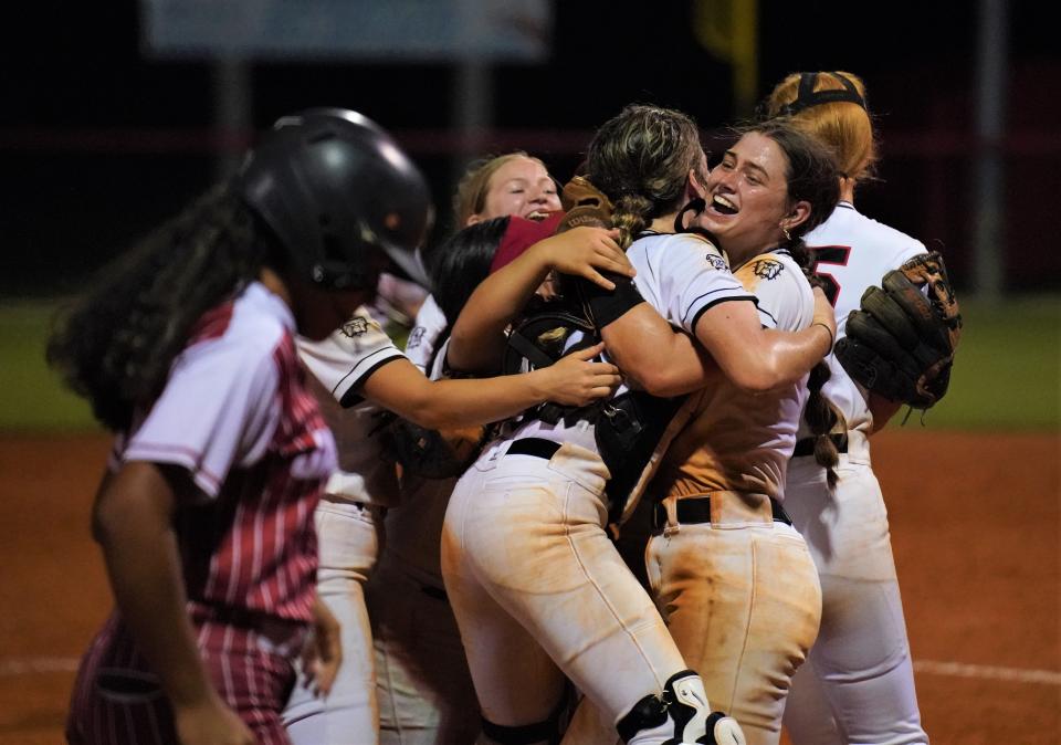 South Fork pitcher Katie Kidwell is hugged by catcher Abbey Moore after the Bulldogs defeated Pembroke Pines Charter 8-3 in the Region 4-5A championship game on Friday, May 19, 2023 in Stuart.