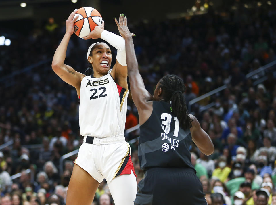 Las Vegas Aces forward A'ja Wilson (22) shoots over Seattle Storm center Tina Charles (31) during the first half in Game 3 of a WNBA basketball semifinal playoff series Sunday, Sept. 4, 2022, in Seattle. (AP Photo/Lindsey Wasson)