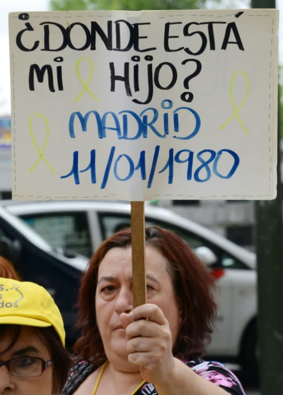 "Where is my son?" reads a placard held up by a woman during a 2013 demonstration over Spain's "stolen babies" scandal