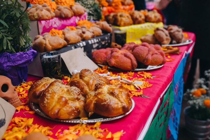 <p>In addition to sugar skulls, another food special to Día de Muertos is pan de muertos, a bread that's sprinkled with sugar and topped with bone-shaped decorations. Other popular Mexican dishes served for the occasion include tortilla soup, chalupas, tamales and caramel flan.</p>
