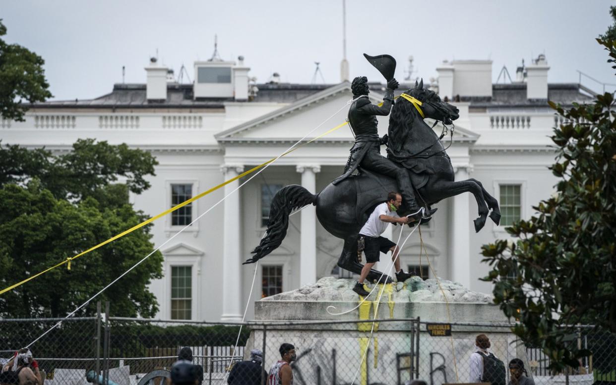 Protesters attempt to pull down the statue of Andrew Jackson in Lafayette Square near the White House - Drew Angerer/Getty Images