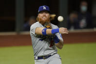 Los Angeles Dodgers third baseman Justin Turner throws out Atlanta Braves' Travis d'Arnaud out at first during the second inning in Game 4 of a baseball National League Championship Series Thursday, Oct. 15, 2020, in Arlington, Texas. (AP Photo/Eric Gay)