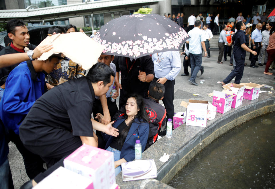 People help an injured person