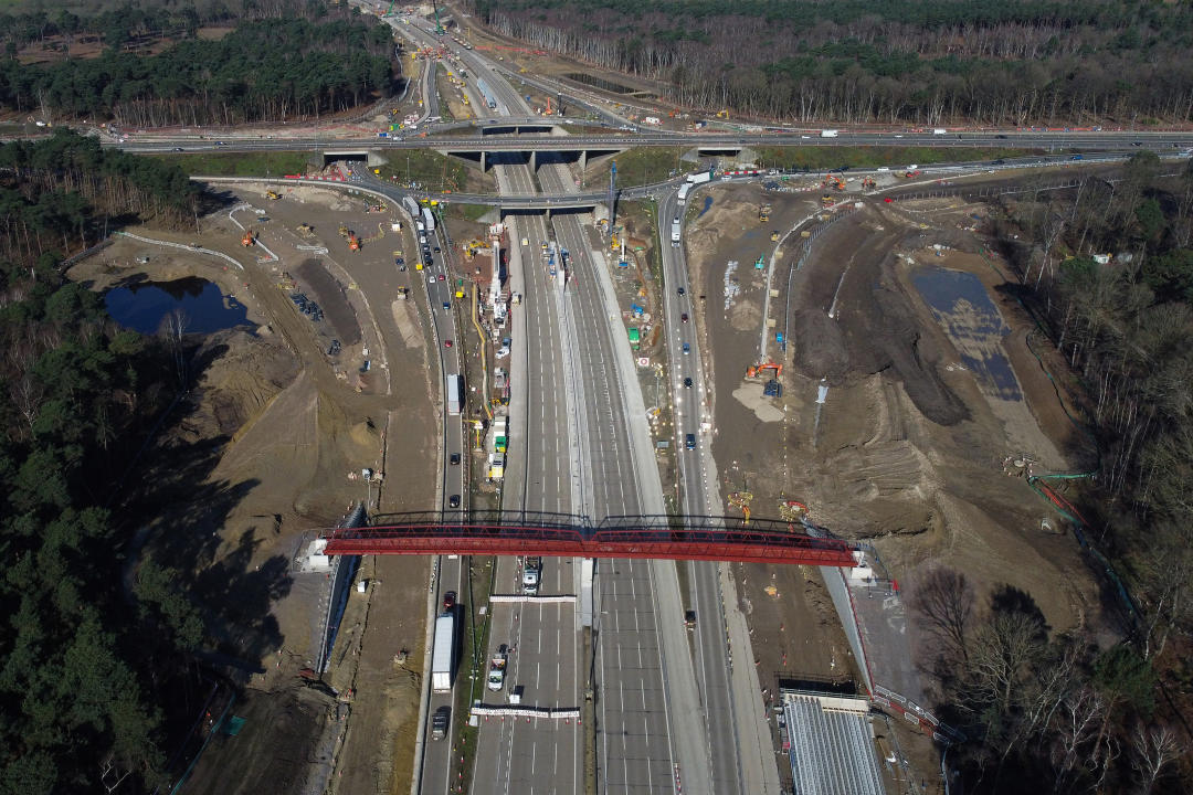 An overhead view shows work ongoing at Junction 10 of the London orbital motorway the M25, near Cobham, south-west of London on March 16, 2024, as the motorway sees it's first total closure over a weekend since it's opening in 1986. The M25 will be closed between junctions 10 and 11 from Friday 15 March evening until Monday 18 March morning to demolish the Clearmount bridleway bridge and install a very large gantry. (Photo by Justin TALLIS / AFP) (Photo by JUSTIN TALLIS/AFP via Getty Images)
