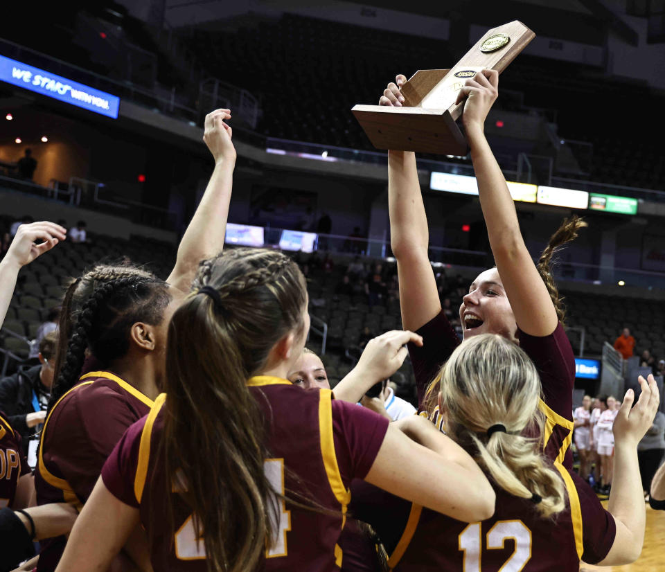 The Cooper Jaguars celebrate after defeating the Ryle Raiders to win their straight Ninth Region championship on Saturday, March 9, 2024.