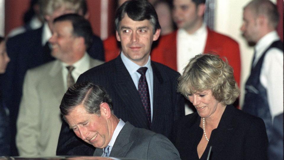 Prince Charles getting in a car with Camilla and his bodyguard Peter Brown