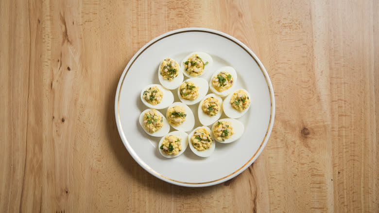 12 deviled eggs on plate 