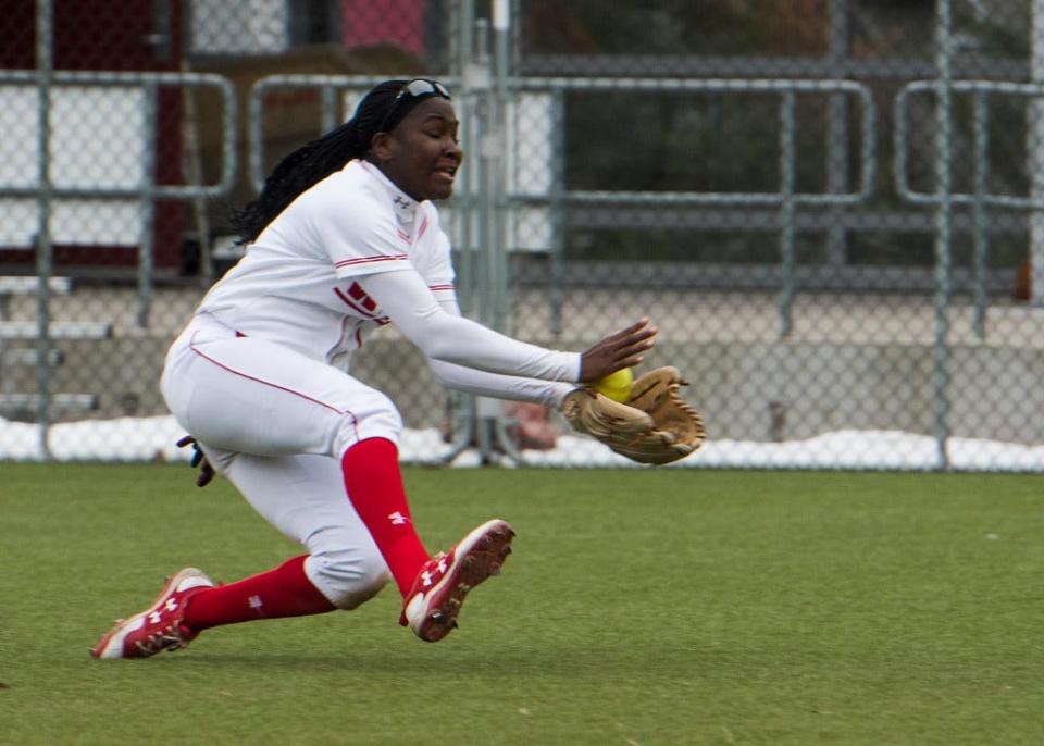 Worcester's Ama Biney makes a diving catch in centerfield for WPI during a game in 2018.