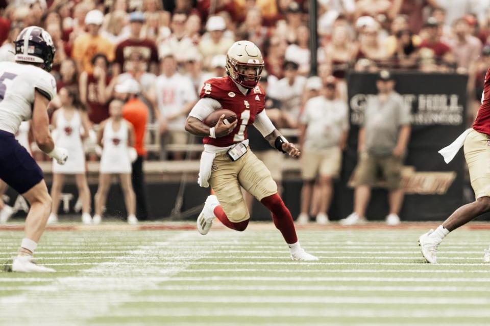 Boston College quarterback Thomas Castellanos (1) keeps the ball during the Eagles game against Holy Cross on Sep. 9, 2023. The Eagles won 31-28.