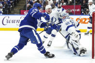 Tampa Bay Lightning goaltender Andrei Vasilevskiy makes a save against Toronto Maple Leafs' Tyler Bertuzzi during the second period of an NHL hockey game Wednesday, April 3, 2024, in Toronto. (Chris Young/The Canadian Press via AP)