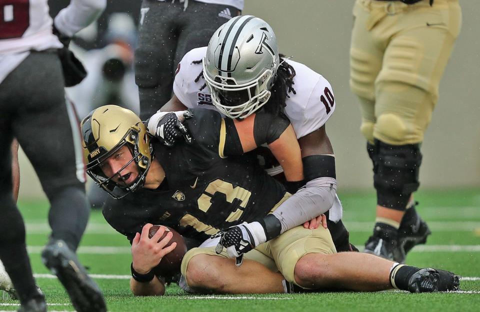 Army quarterback Bryson Daily is tackled early in the game against Troy. Daily later left the game with a non-contact leg injury. DANNY WILD, USA TODAY Sports