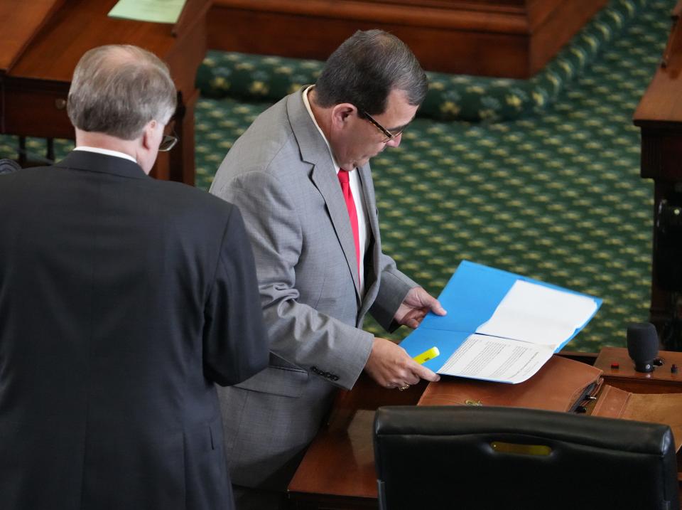 Sen. Pete Flores, R - Pleasanton,  who is on the committee to create the rules for the impeachment trial of Attorney General Ken Paxton, looks at the Draft Rules and Procedures for Court of Impeachment, in the Senate Chamber at the Capitol before the Senate was expected consider the rules on Tuesday June 20, 2023.