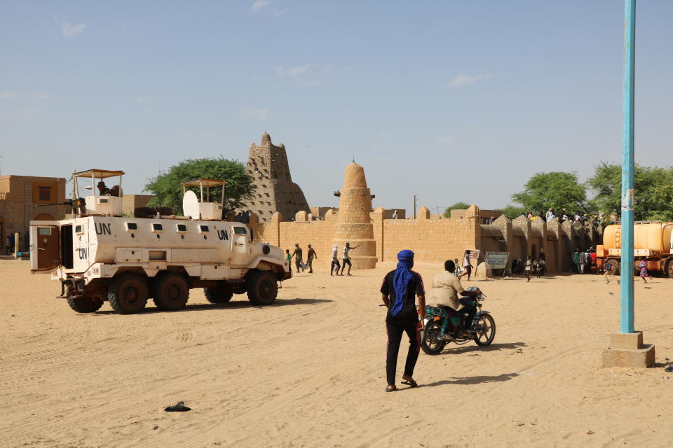 FILE - United Nations forces patrol the streets of Timbuktu, Mali, on Sept. 26, 2021. In June 2023, pressure from Mali's military government spurred the U.N. to end their peacekeeping mission, which has played a role in safeguarding civilians from armed groups, aiding logistics for local aid organizations, negotiating a peace deal with Tuareg rebels, and doling out contracts to individuals and businesses to assist its operations. (AP Photo/Moulaye Sayah, File)