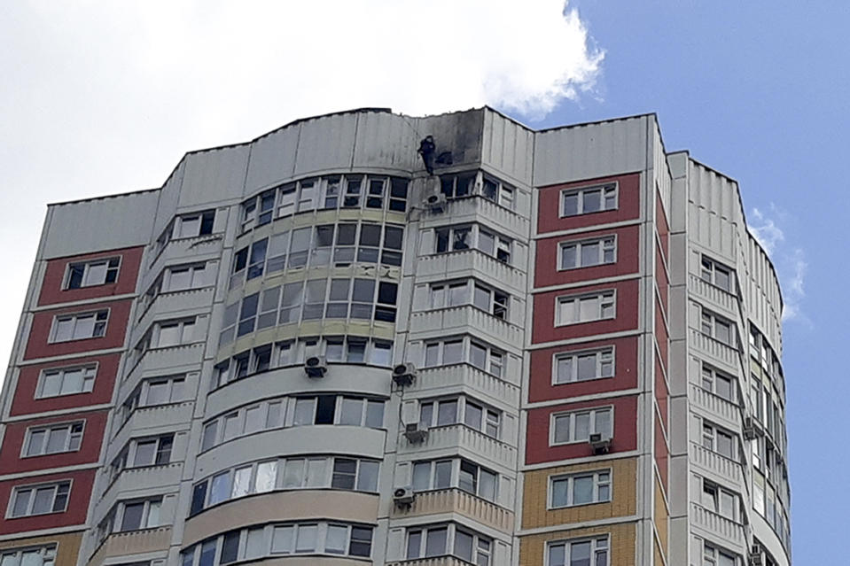 An investigator inspects a damage after a Ukrainian drone attacked an apartment building in Moscow, Russia, Tuesday, May 30, 2023. In Moscow, residents reported hearing explosions and Mayor Sergei Sobyanin later confirmed there had been a drone attack that he said caused "insignificant" damage. (AP Photo)