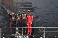 First place Red Bull driver Max Verstappen of the Netherlands, second right, poses on the podium with second place Red Bull driver Sergio Perez of Mexico, second left, and third place Ferrari driver Charles Leclerc of Monaco, right, during the Formula One Grand Prix at the Spa-Francorchamps racetrack in Spa, Belgium, Sunday, July 30, 2023. (AP Photo/Geert Vanden Wijngaert)
