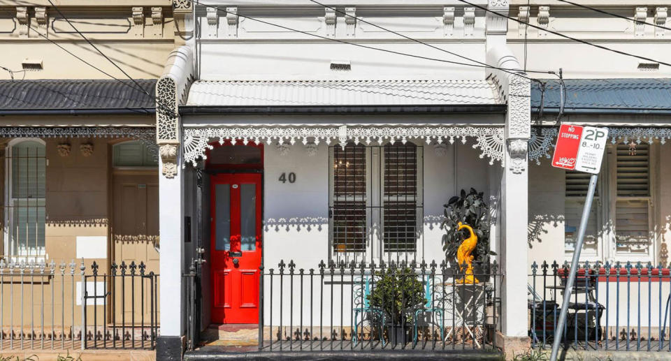 Front of Newtown terrace with red door. 