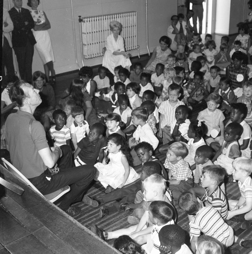 Folk legend Pete Seeger performs for children in this photo from July 22, 1965.