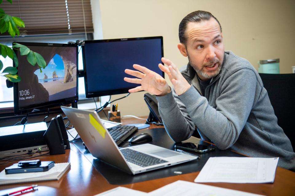 Jason Funk talks about the racist language used in local deeds many decades ago while working on a project about that portion of history in the Monroe County Recorder's Office on Friday, Jan. 27, 2023.