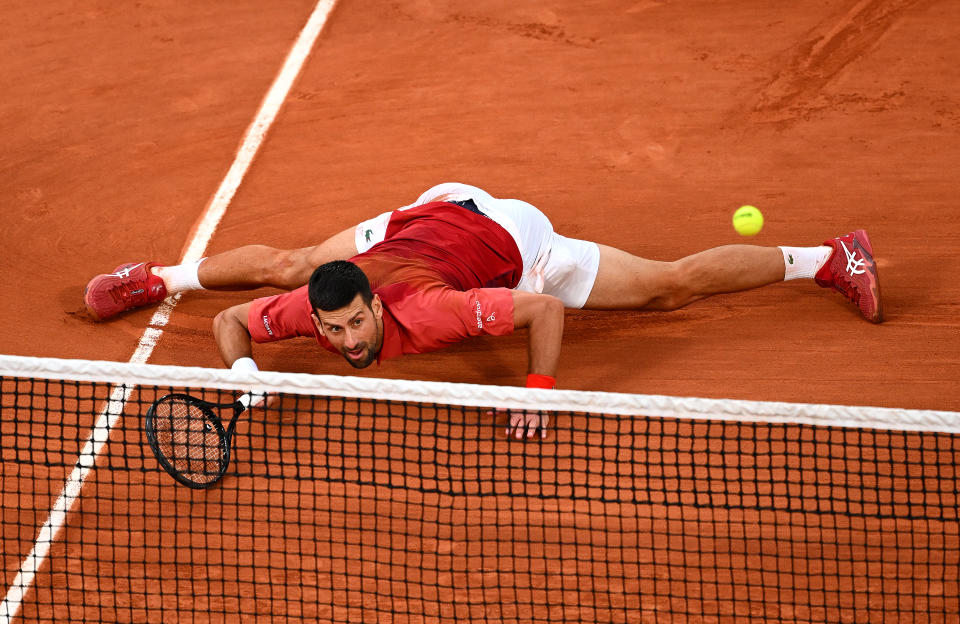 In case you'd forgotten, Djokovic is comically flexible. (Clive Mason/Getty Images)