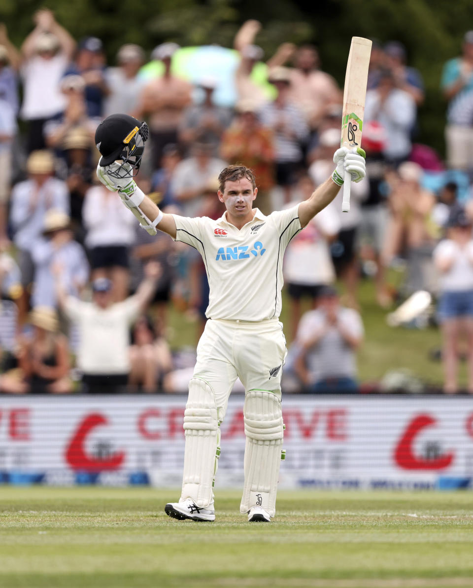 Tom Latham of New Zealand celebrates his century during play on day one of the second cricket test between Bangladesh and New Zealand at Hagley Oval in Christchurch, New Zealand, Sunday, Jan. 9, 2022. (Martin Hunter/Photosport via AP)