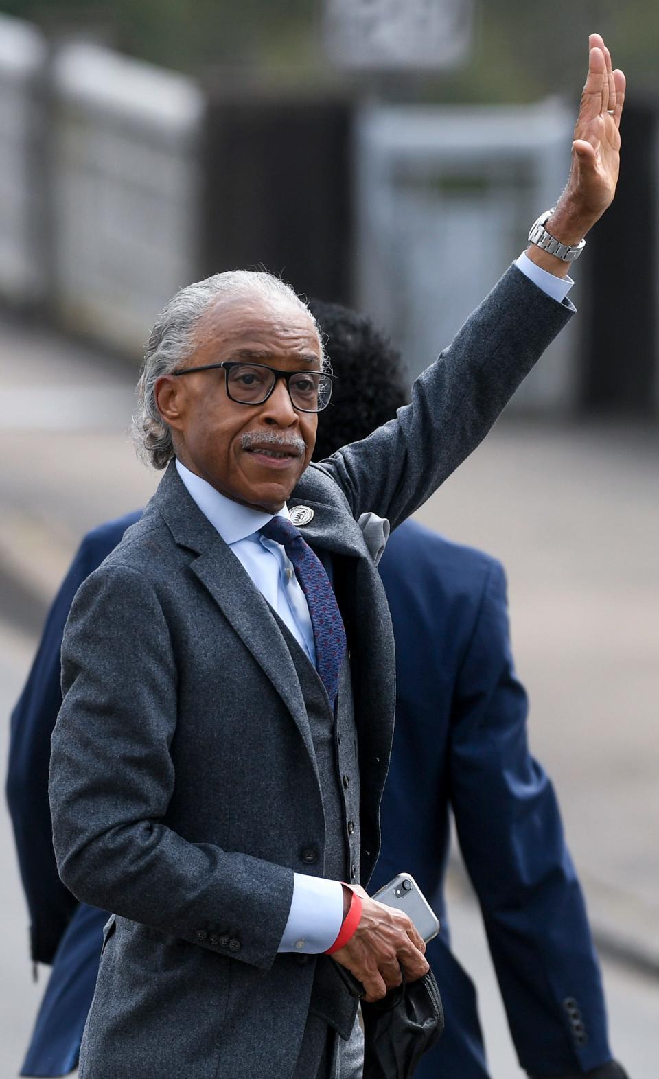 Al Sharpton waves as he arrives during the 57th anniversary of the Bloody Sunday March in Selma, Ala., on Sunday March 6, 2022.