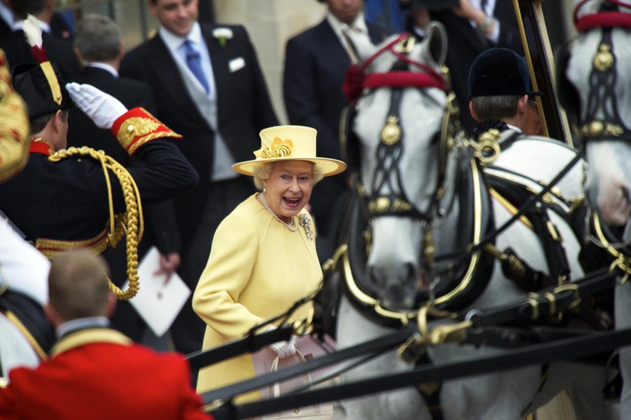 Queen Elizabeth and Prince Philip depart Westminster Abbey following the royal wedding of her grandson, Prince William, and Kate Middleton.