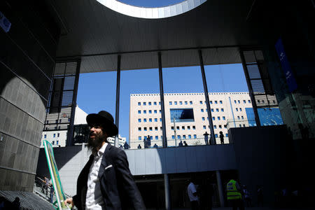 An ultra-Orthodox Jewish man walks inside Israel's new high-speed rail line station in Jerusalem September 25, 2018. REUTERS/Amir Cohen
